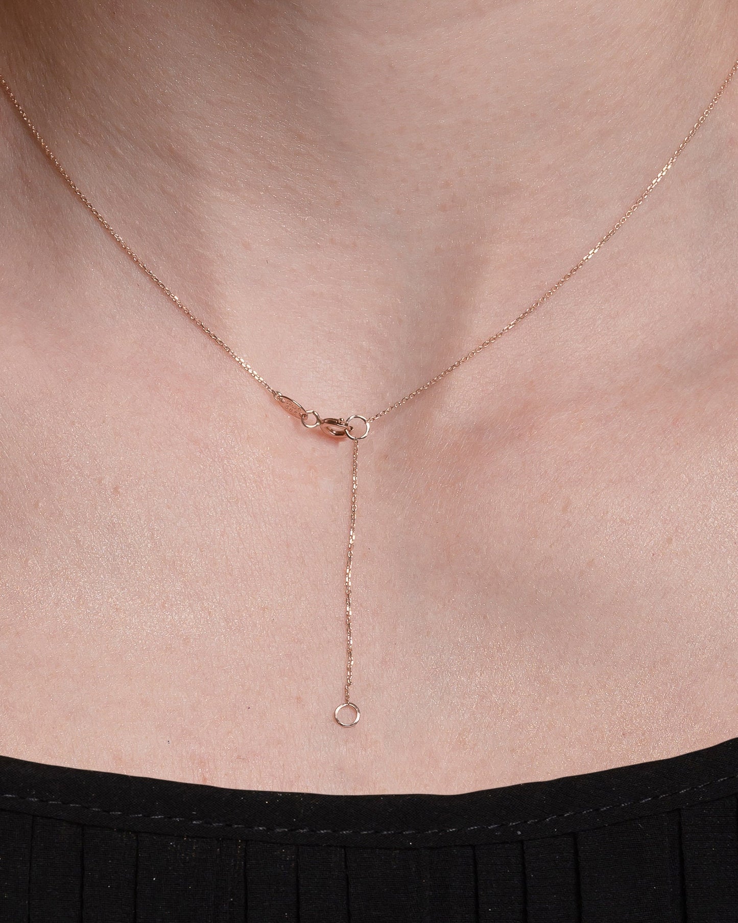 14k gold spring ring clasp for a necklace with a 5cm extender worn by a model
