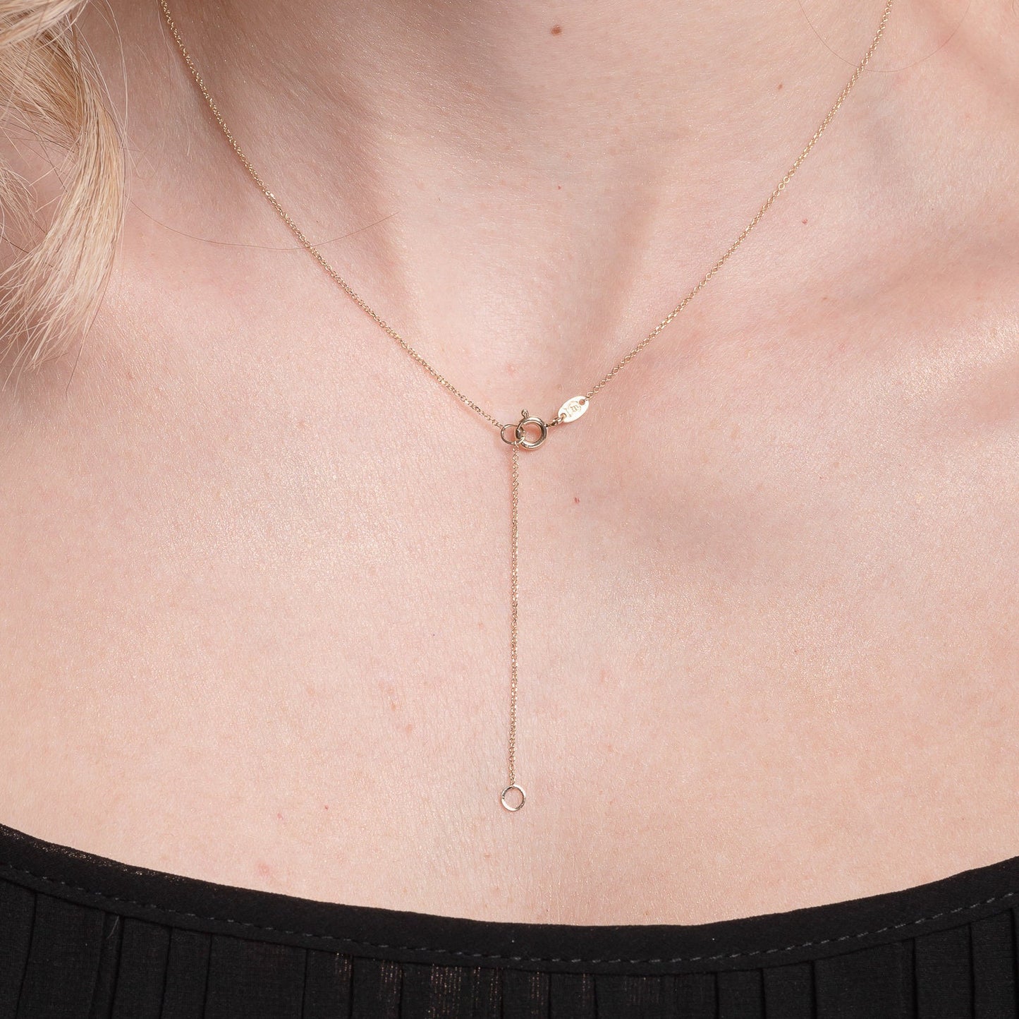 14k gold spring ring clasp for a necklace with a 5cm extender worn by a model