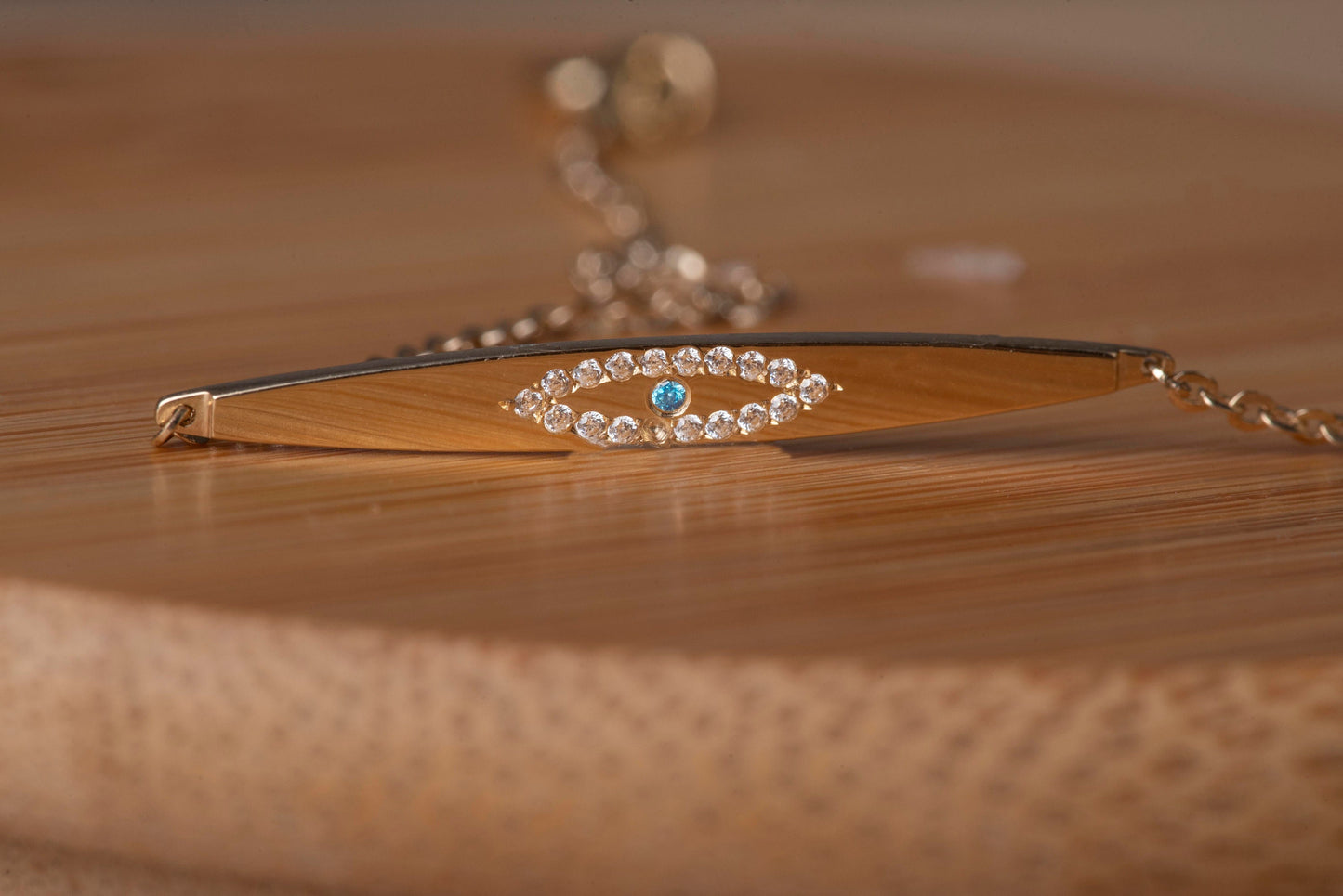 evil eye ID bracelet in 14k yellow gold