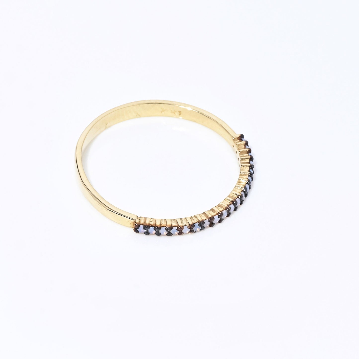 A delicate Opal ring set in 14k gold with a prong setting, designed for women.