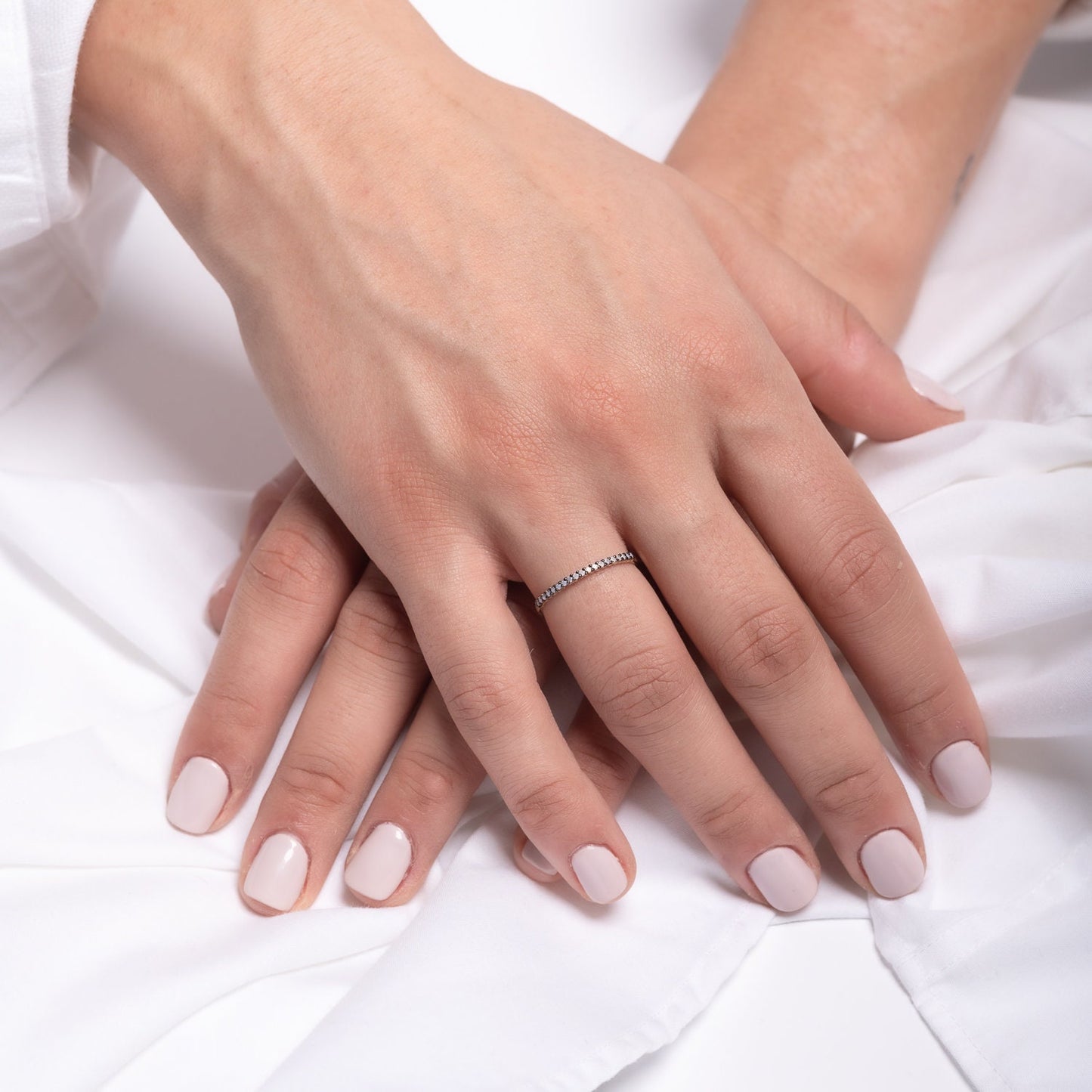 A delicate Opal ring set in 14k gold with a prong setting, designed for women.