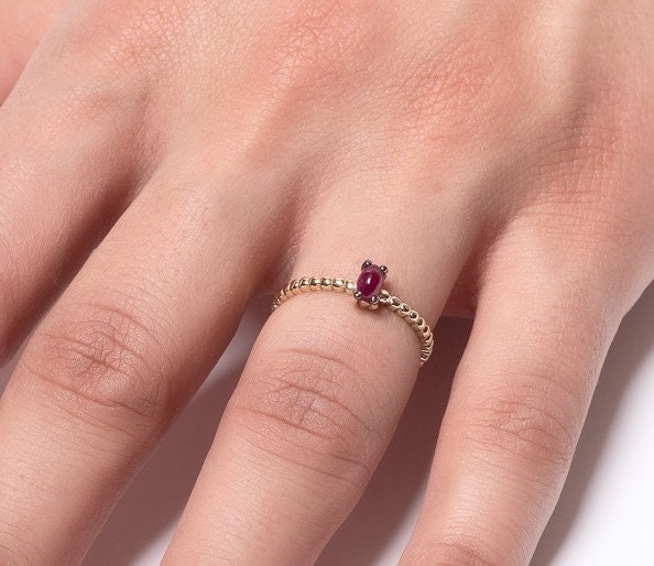 Handmade 14K gold ring with ruby beads for women, set in prongs.