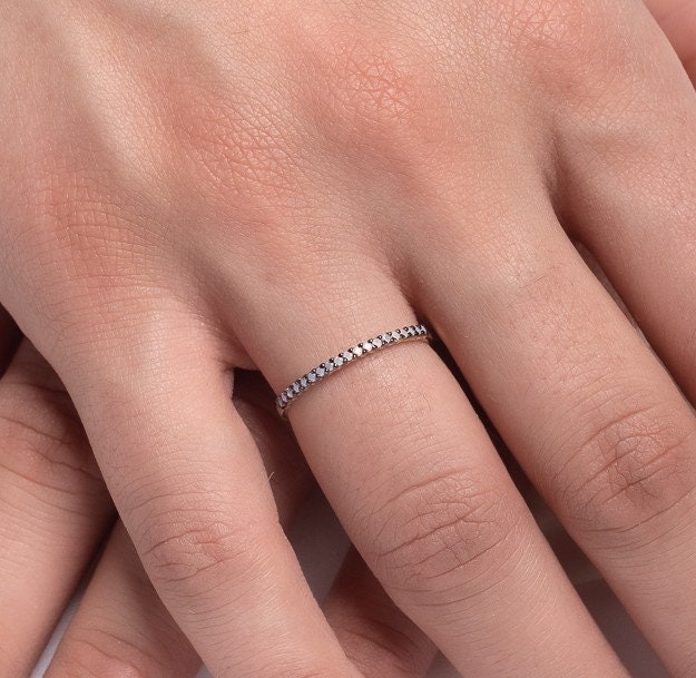 A delicate Opal ring set in 14k gold with a prong setting, designed for women.