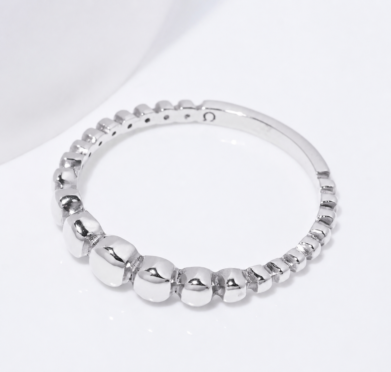 14k white Gold beaded ring on a white background