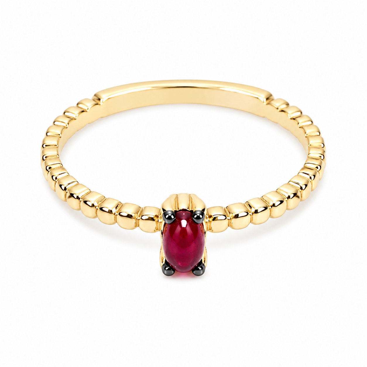 14k Gold beaded ring with ruby on a white background