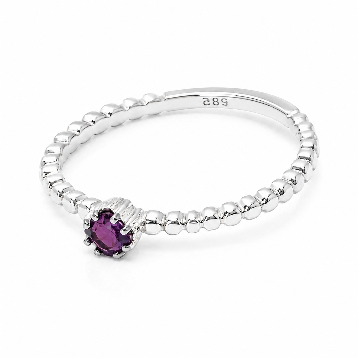 14k white Gold ring with a ruby gemstone on a white background