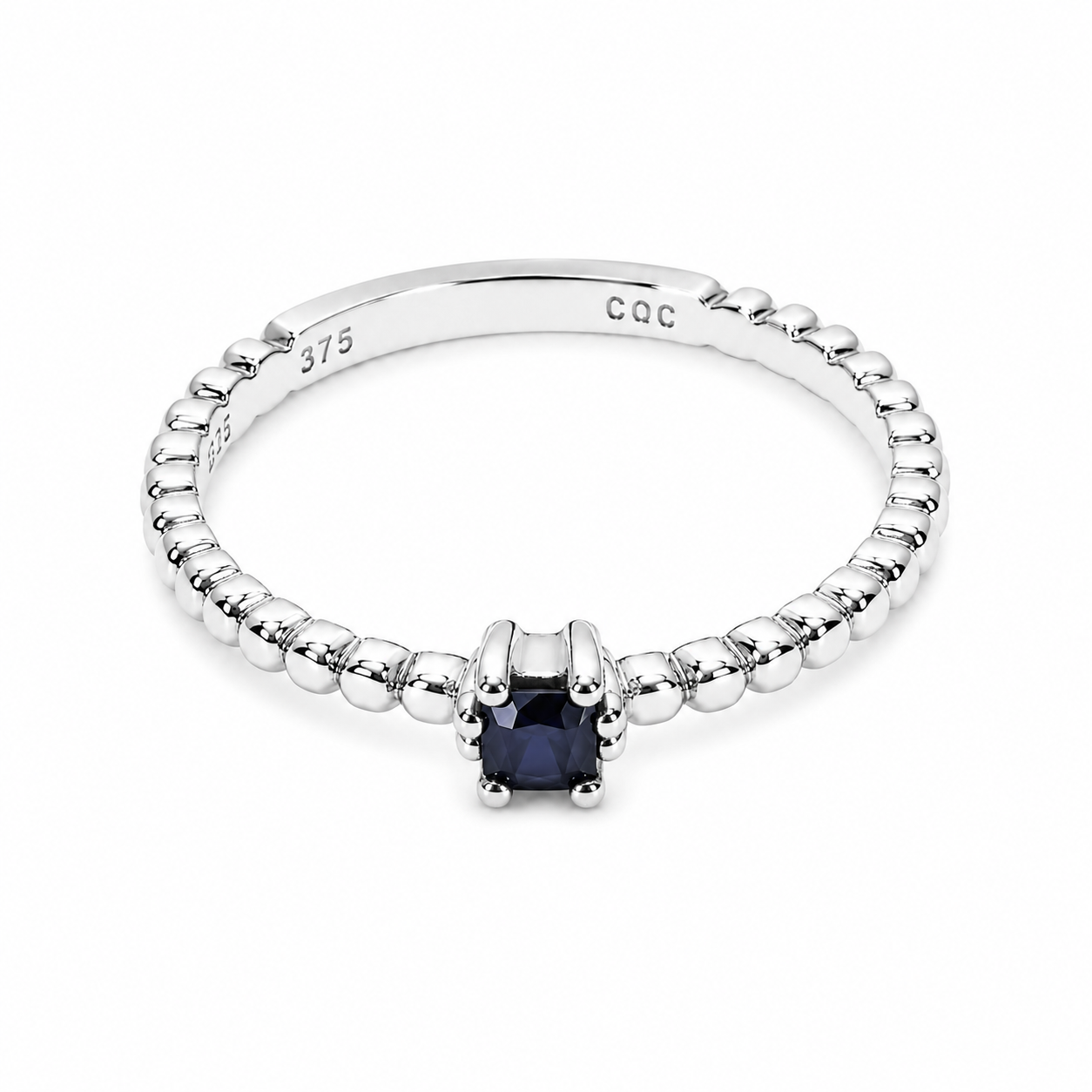 14k white Gold beaded ring with a blue sapphire gemstone on a white background
