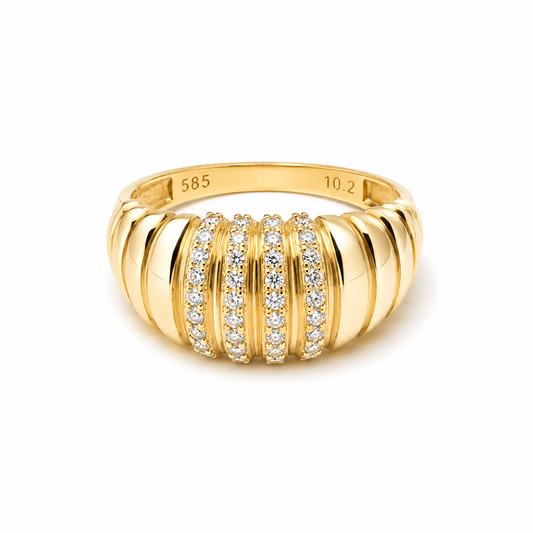 Ribbed dome ring in 14k gold with cubic zirconia stones in a white background