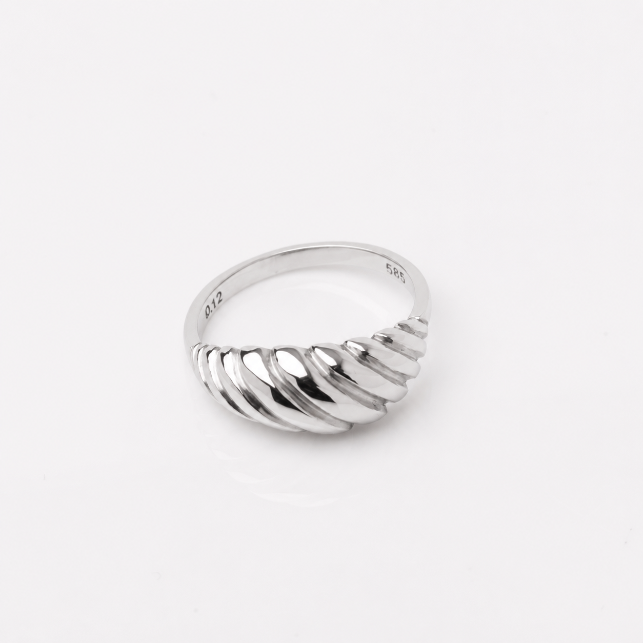 14k white Gold ring with a textured design on a white background
