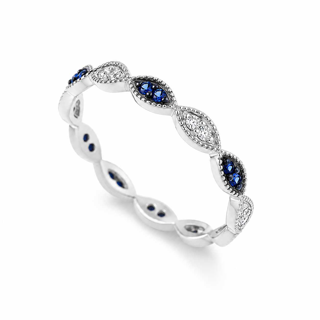 14k white Gold ring with blue and clear gemstones on a white background
