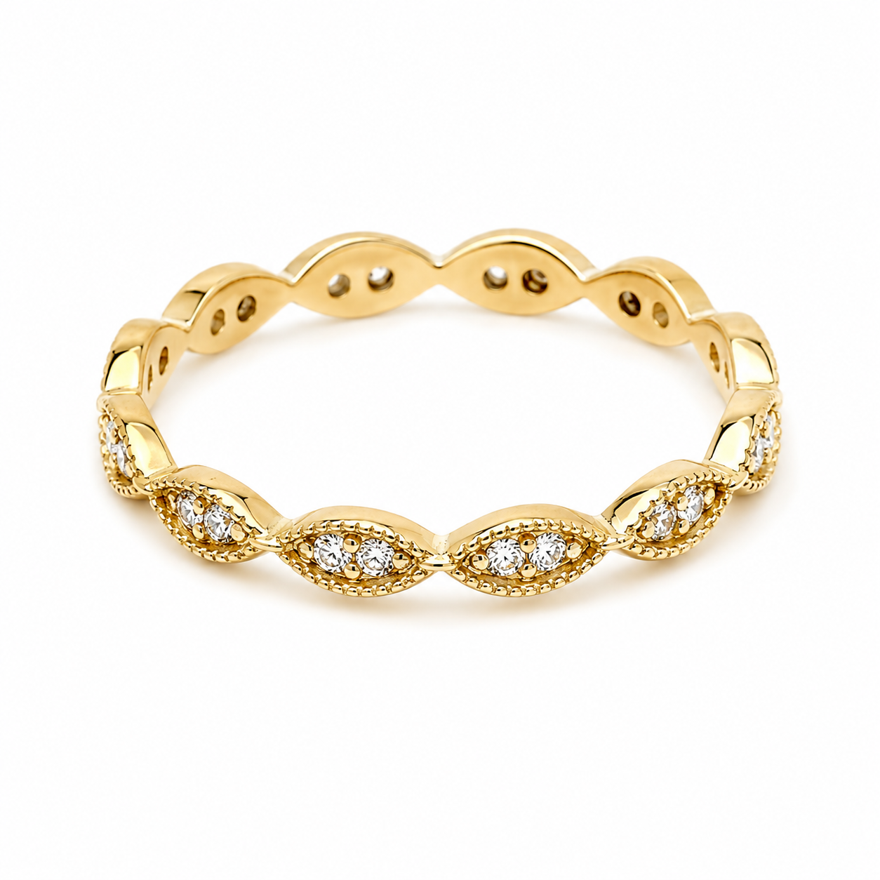 14k gold ring with white cubic zirconia stones in white background