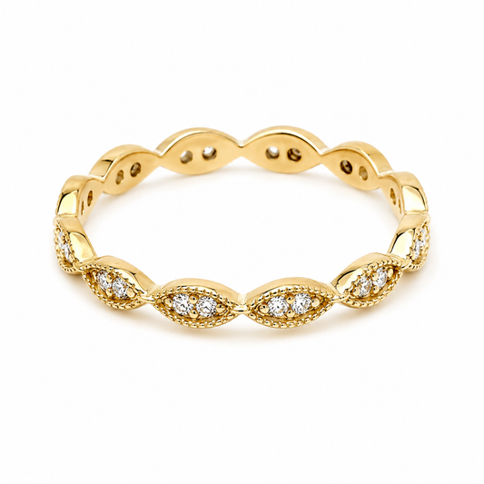 14k gold ring with white cubic zirconia stones in white background