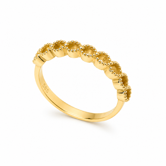 14K Gold ring with textured band on a white background