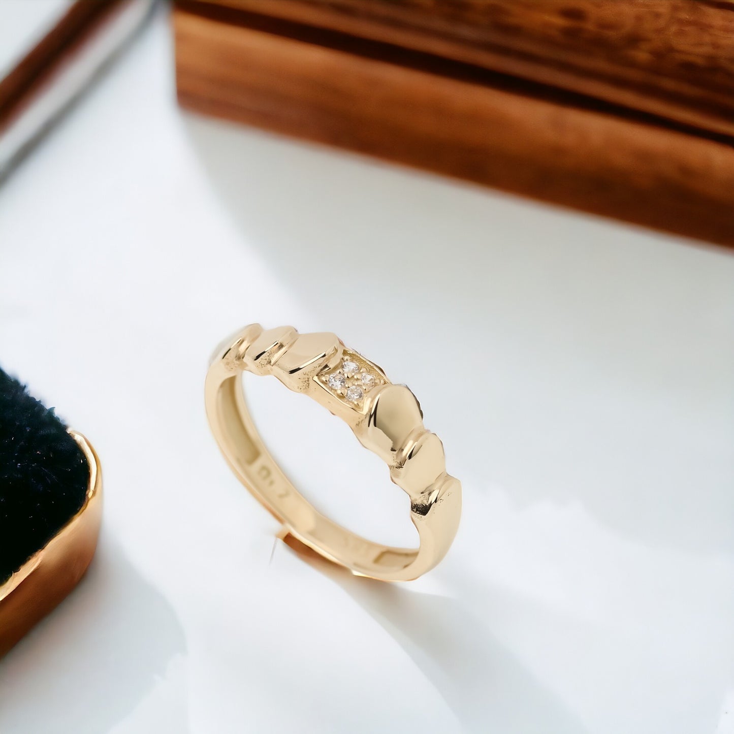 Handmade wrapped ring in 14k solid gold, the top part of the ring is encrusted with white cubic zirconia stones.