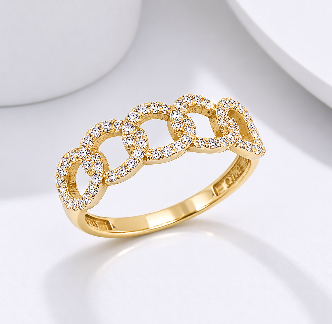 14k Gold ring with cubic zirconia accents on a white background
