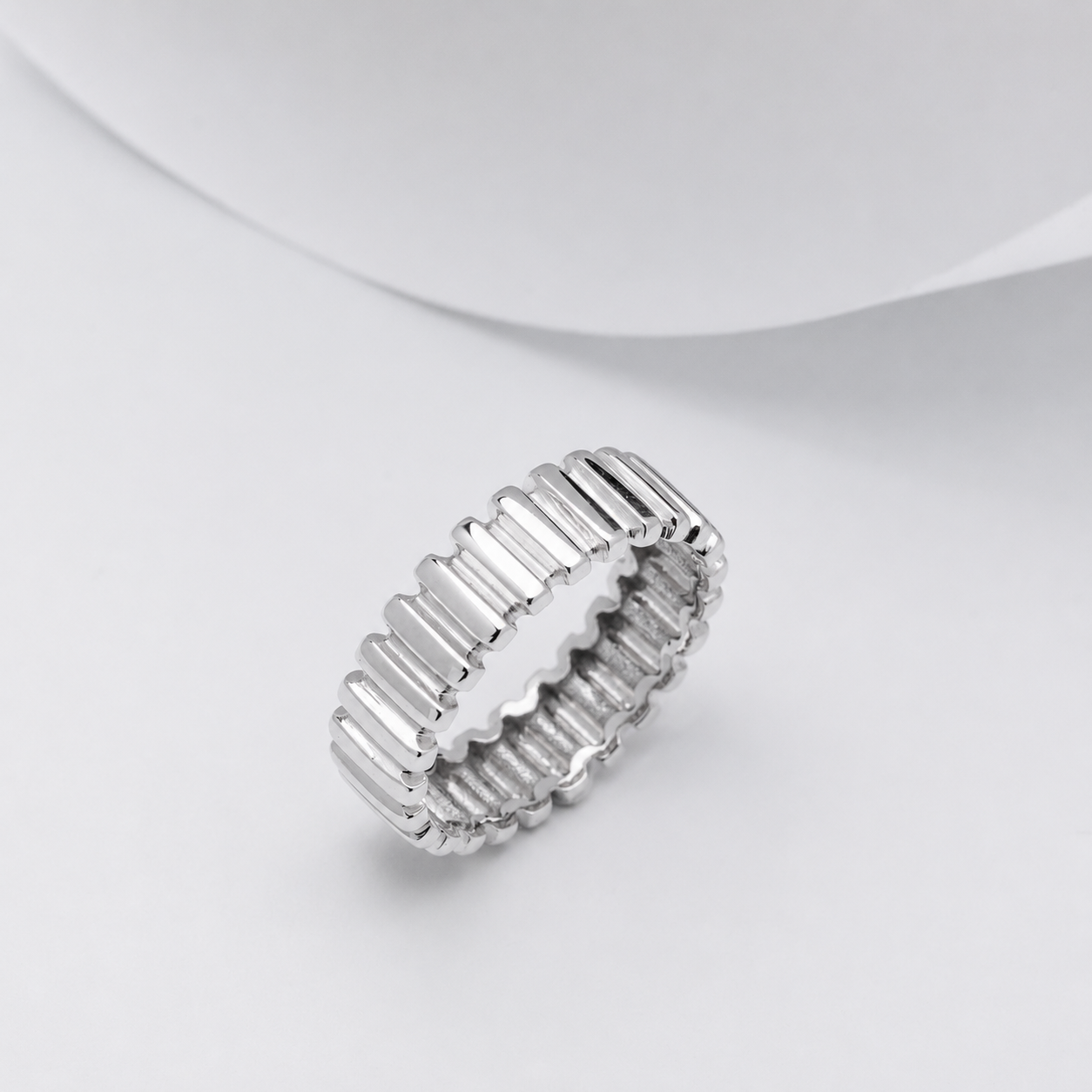 14K White Gold ring with a textured design on a white background