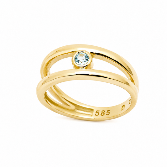 14k Gold ring with a blue aquamarine gemstone on a white background
