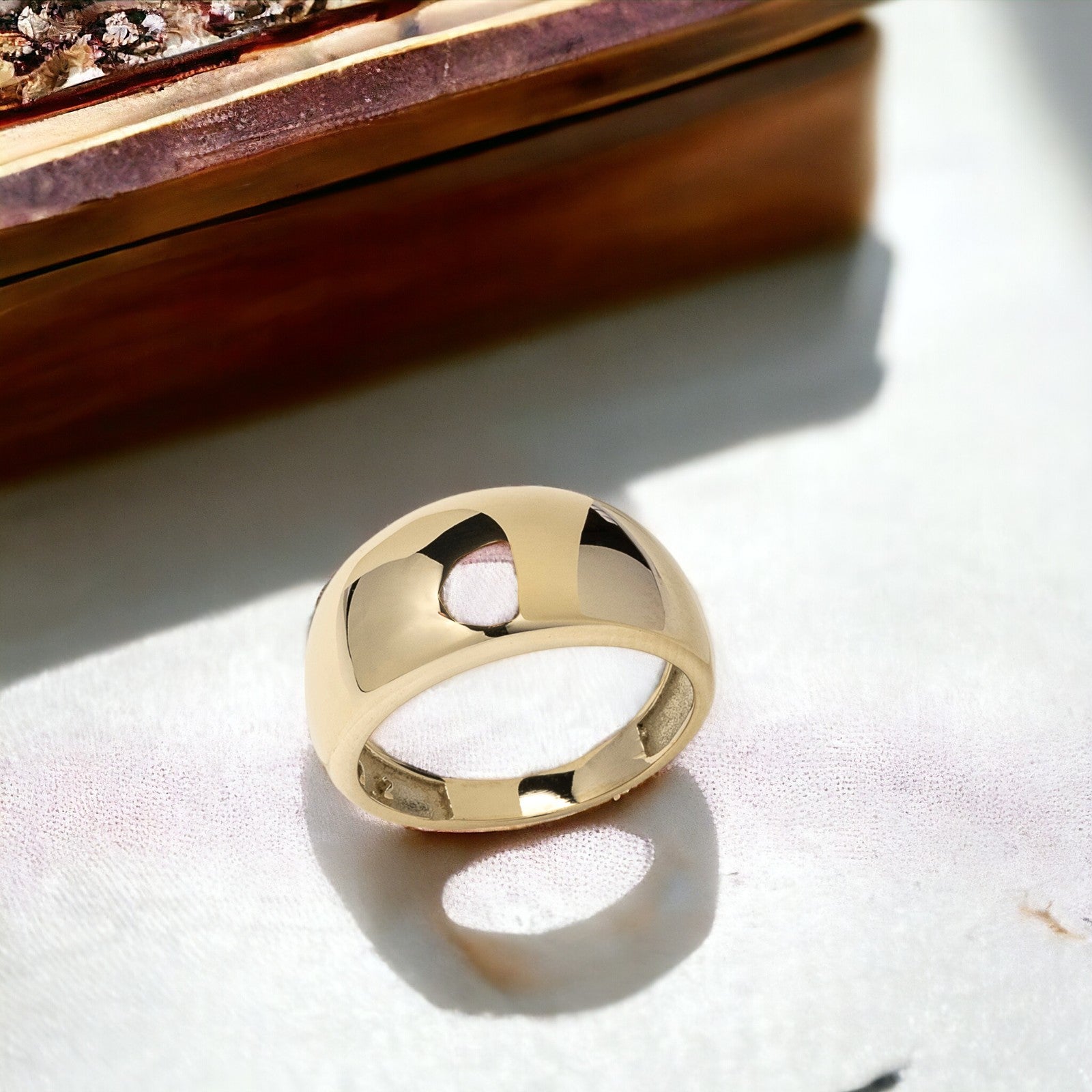 A thick 9mm dome ring crafted in 14k solid gold for women.