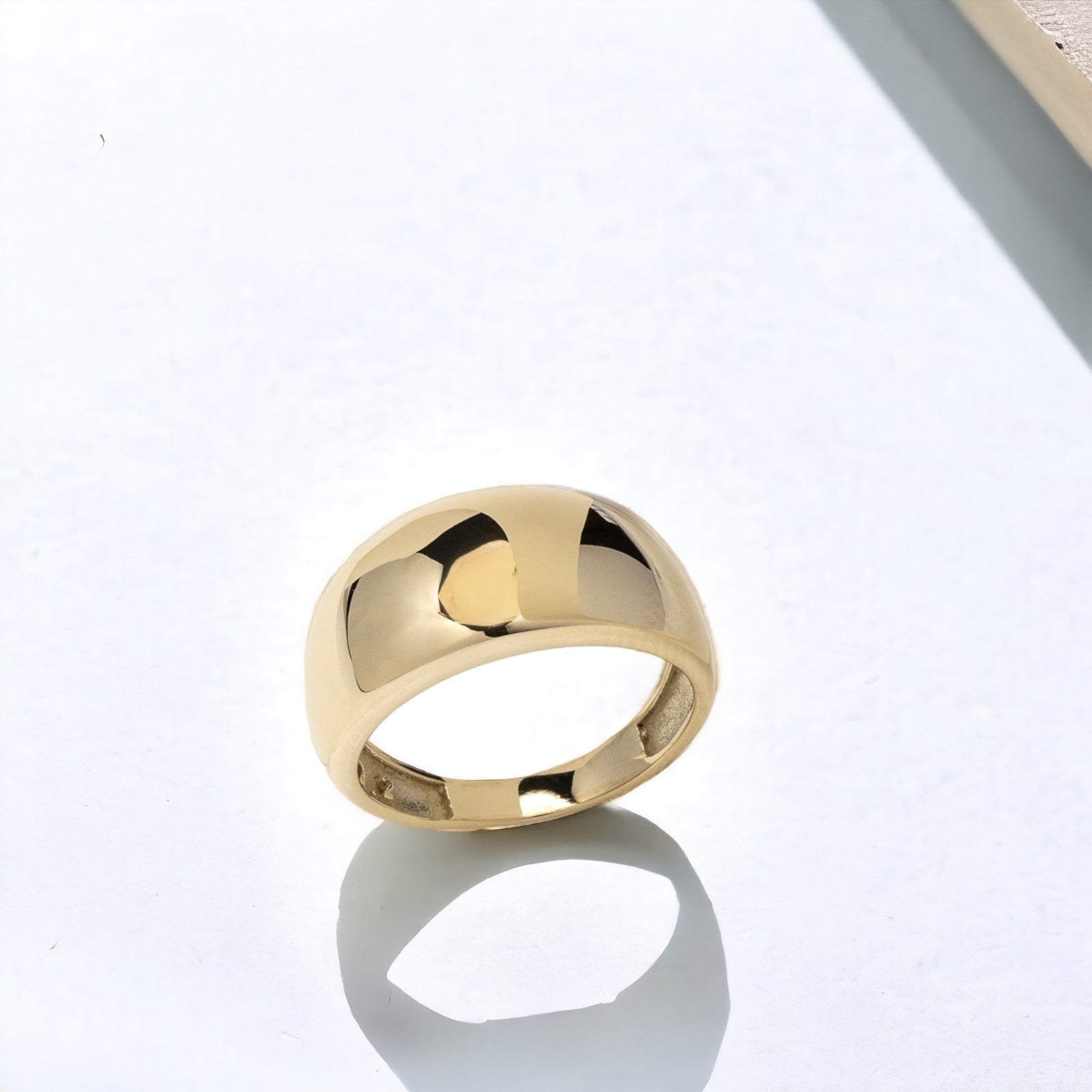 A thick 9mm dome ring crafted in 14k solid gold for women.