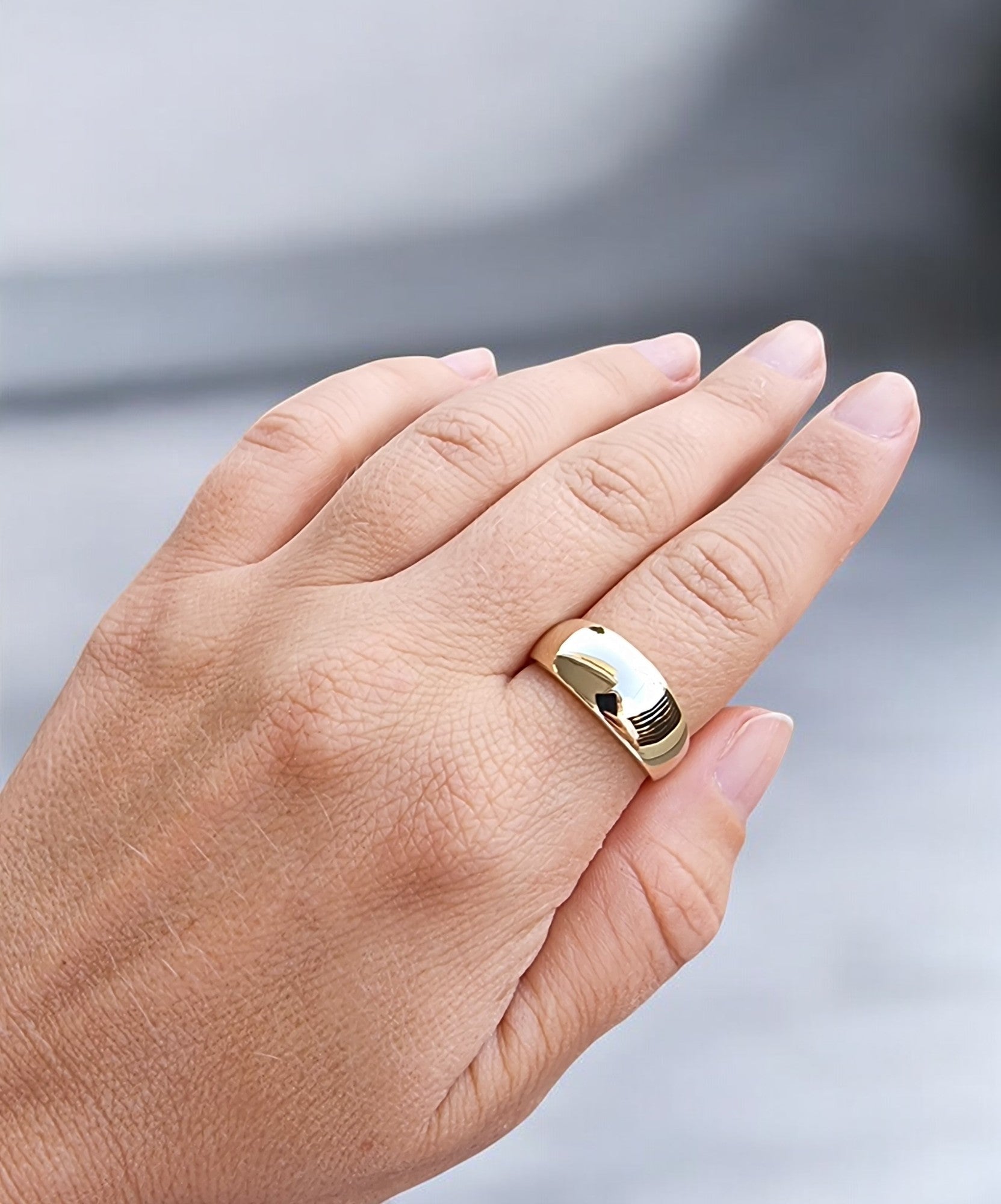 A thick 9mm dome ring crafted in 14k solid gold for women.