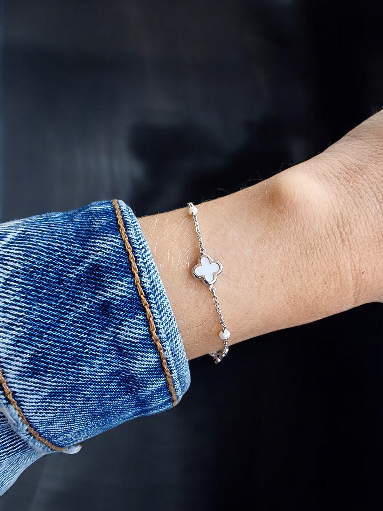 Mother of Pearl Four Leaf Clover Bracelet featuring three clover designs and four pearls.