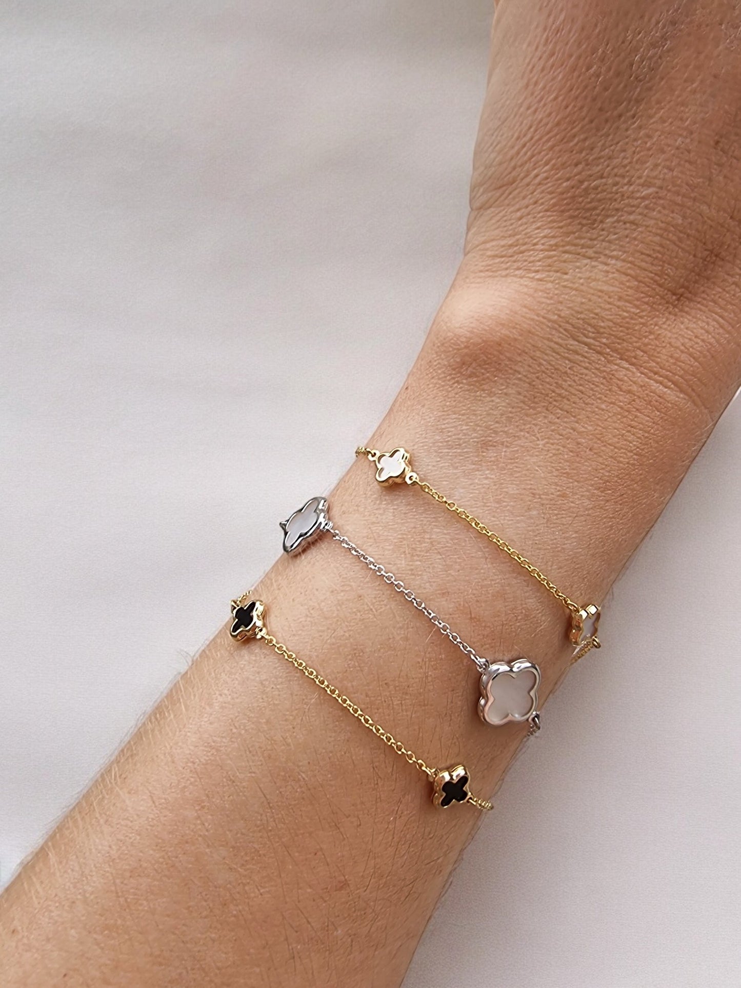 14K Gold Four Leaf Clover Bracelets for women, featuring mother of pearl and black onyx motifs