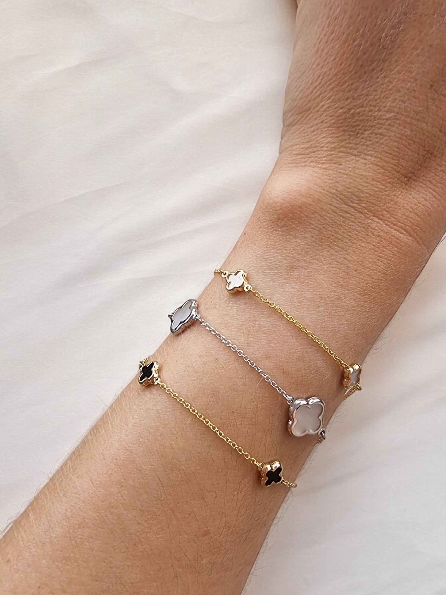 14K Gold Four Leaf Clover Bracelets for women, featuring mother of pearl and black onyx motifs