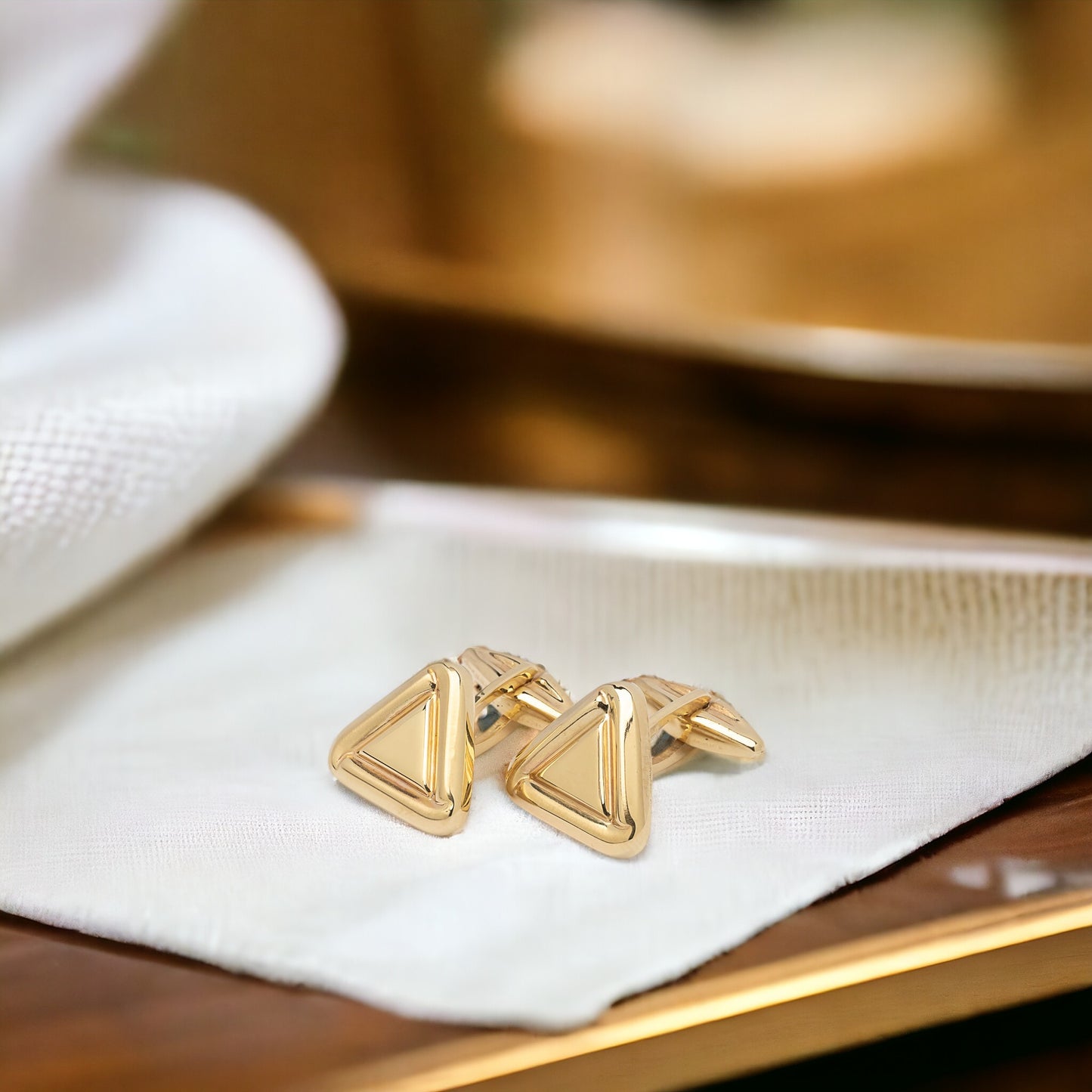 Triangle cufflinks in solid 14K yellow gold.