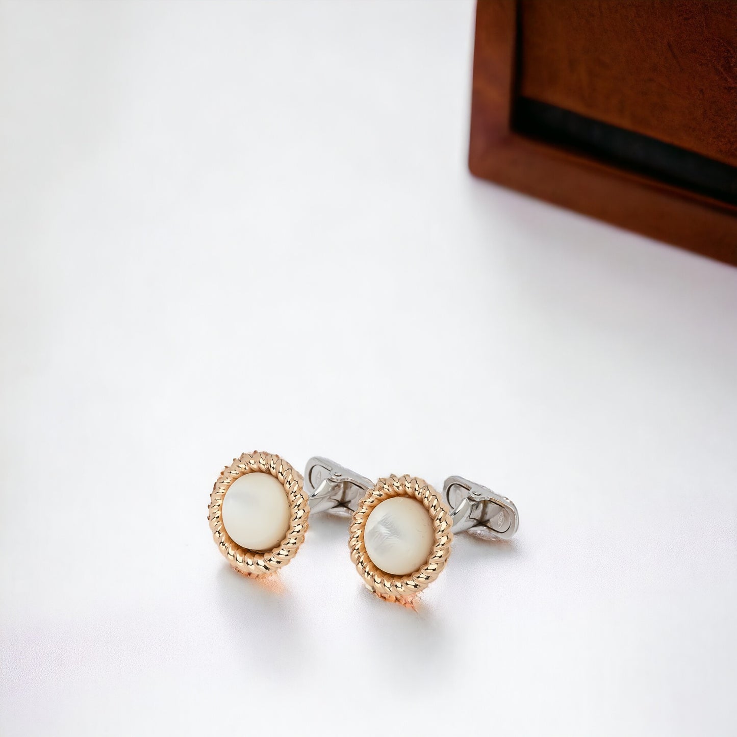 Mother of Pearl cufflinks crafted in 14K yellow and white gold.