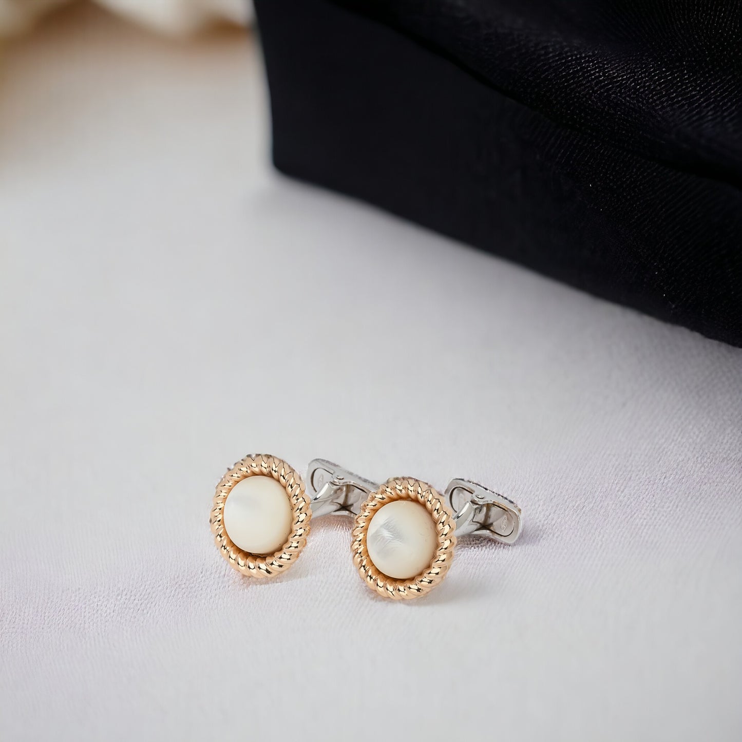 Mother of Pearl cufflinks crafted in 14K yellow and white gold.