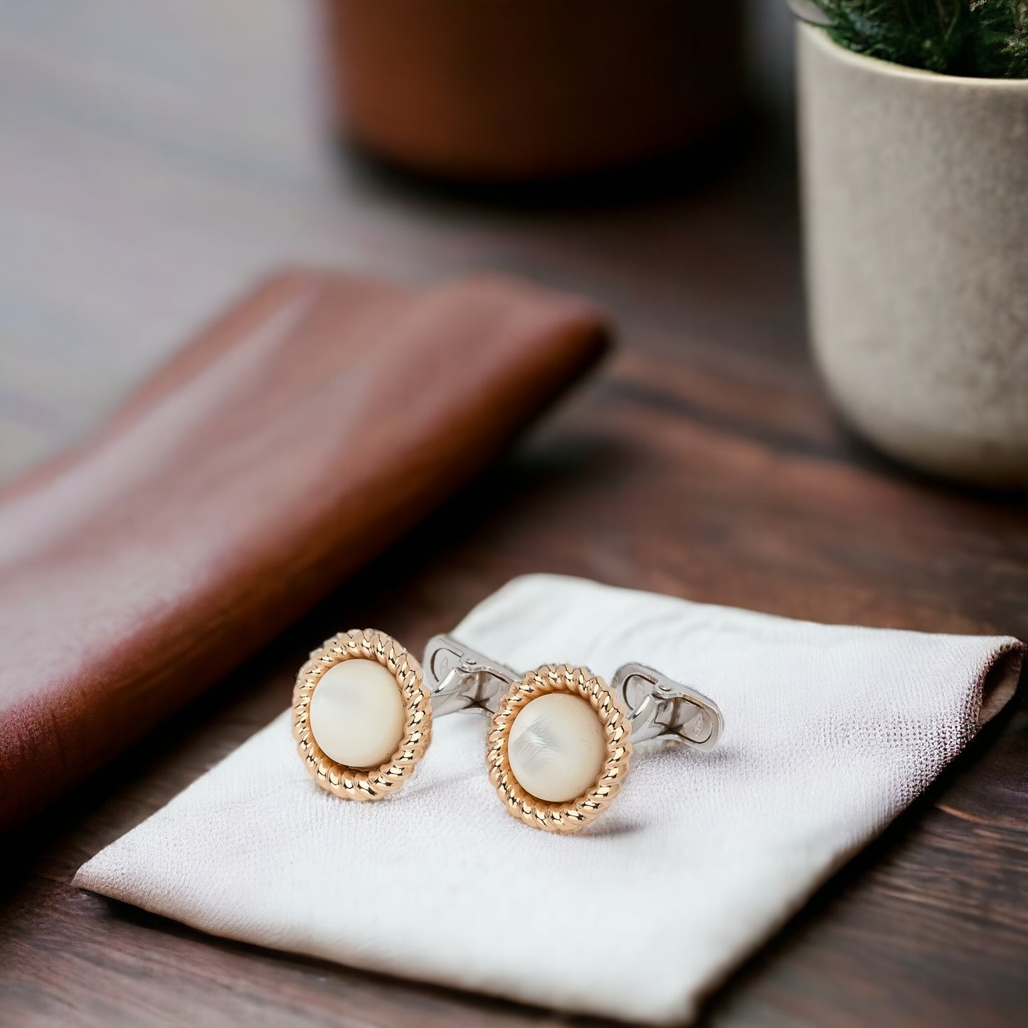 Mother of Pearl cufflinks crafted in 14K yellow and white gold.