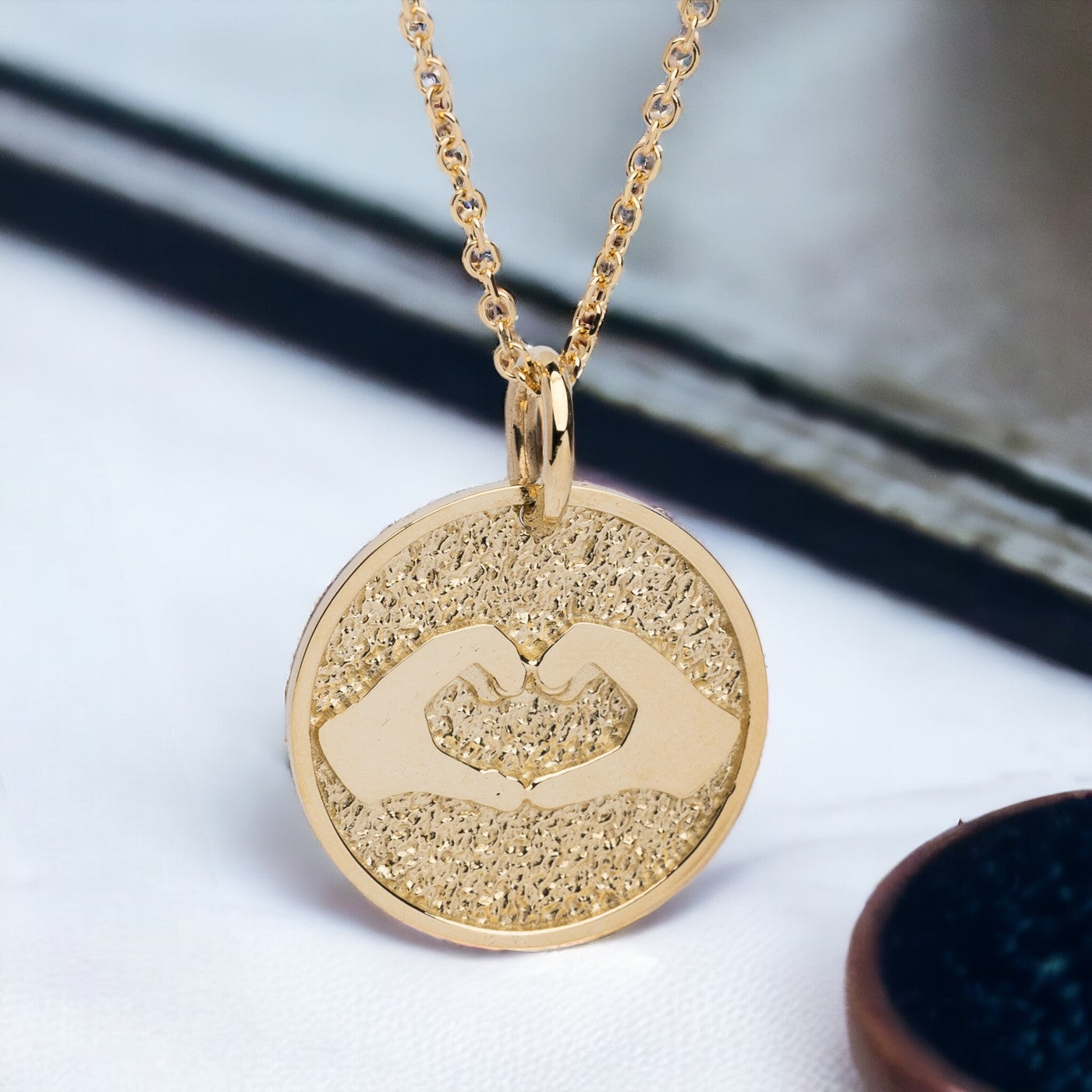 Hand Gesture Heart Necklace in 14k solid gold for women with free engraving on the back side.