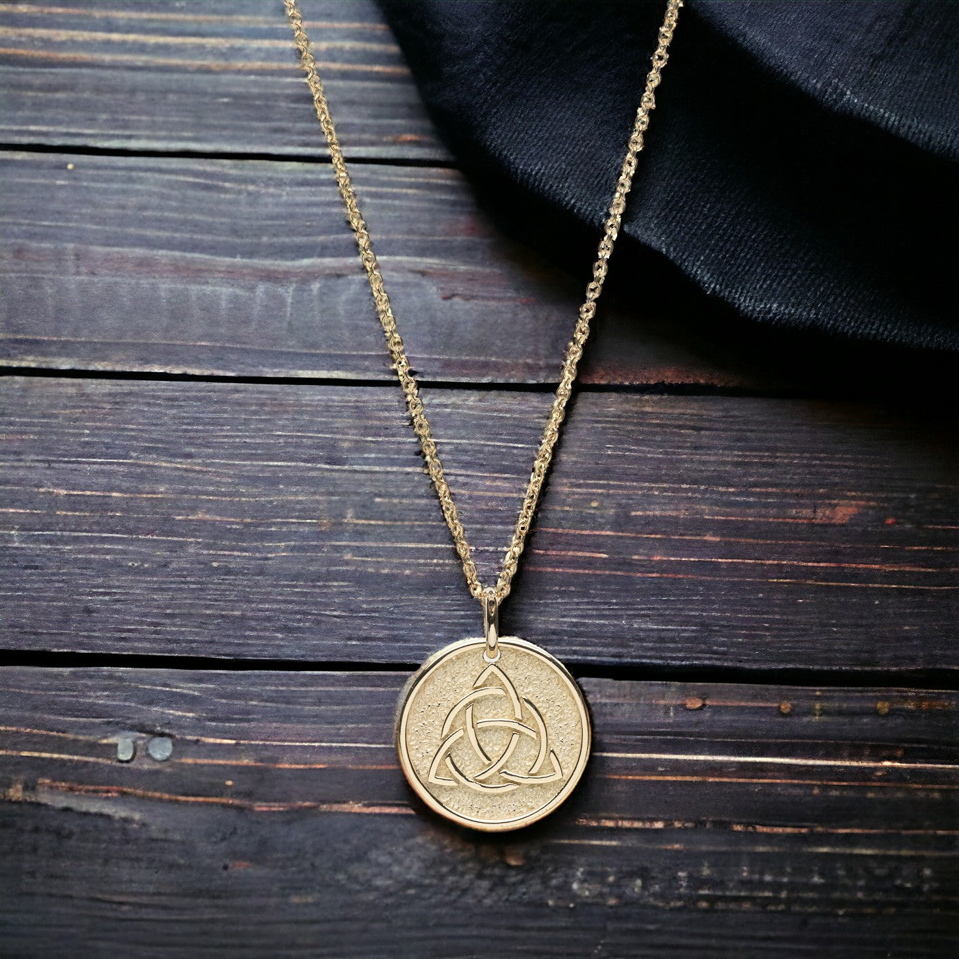 Trinity Knot Necklace in 14k solid gold for women, with complimentary engraving on the reverse side.