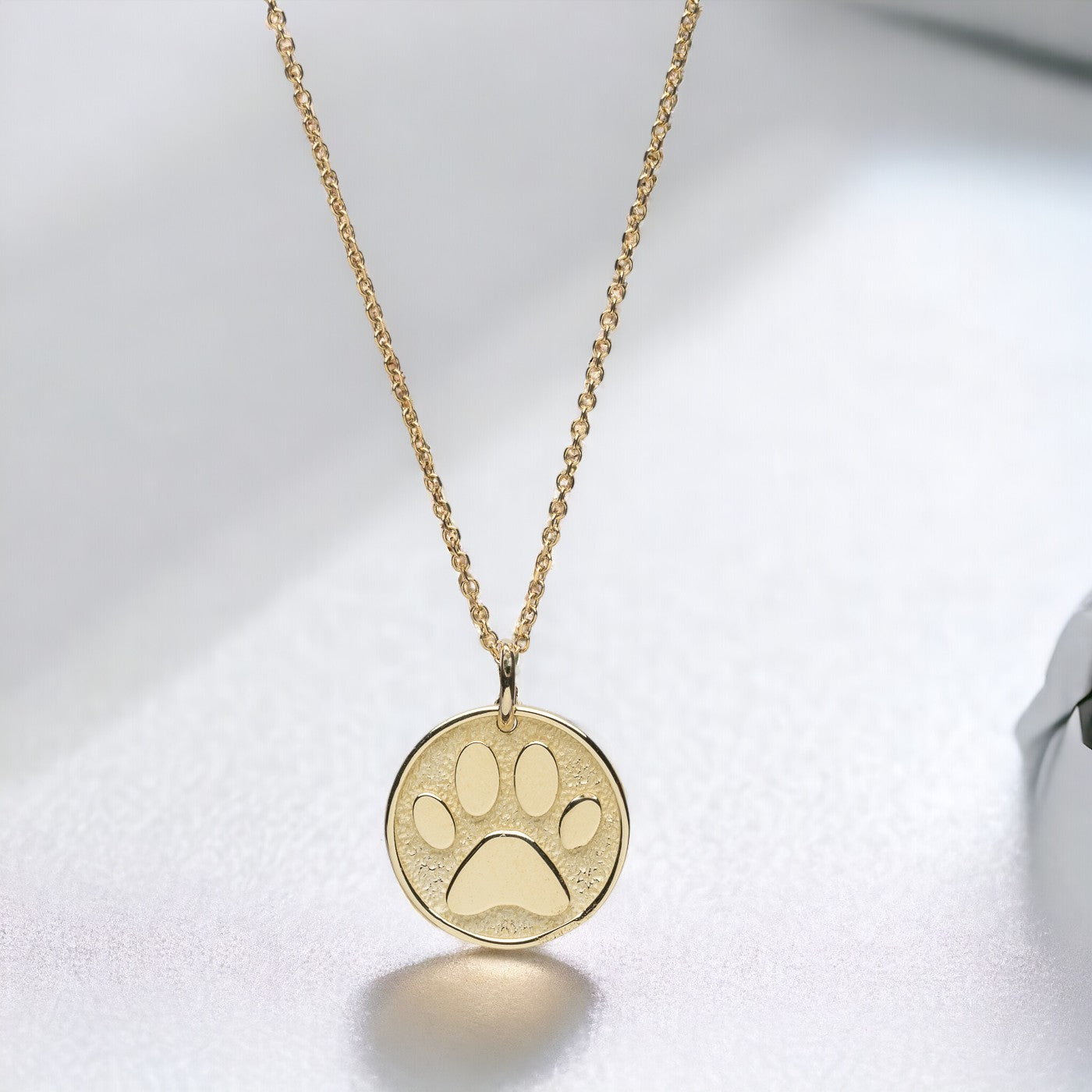 Paw Pendant crafted in 14k solid gold, complete with complimentary engraving on the reverse side.