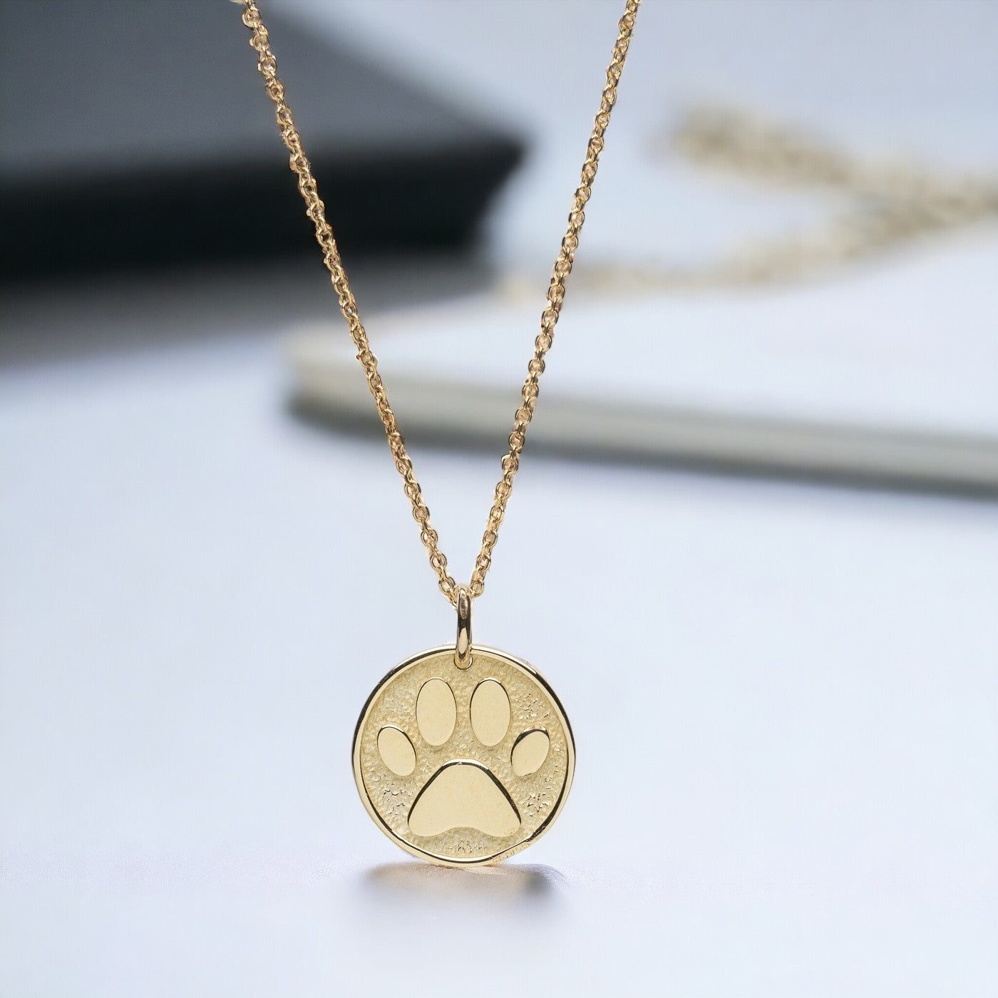 Paw Pendant crafted in 14k solid gold, complete with complimentary engraving on the reverse side.