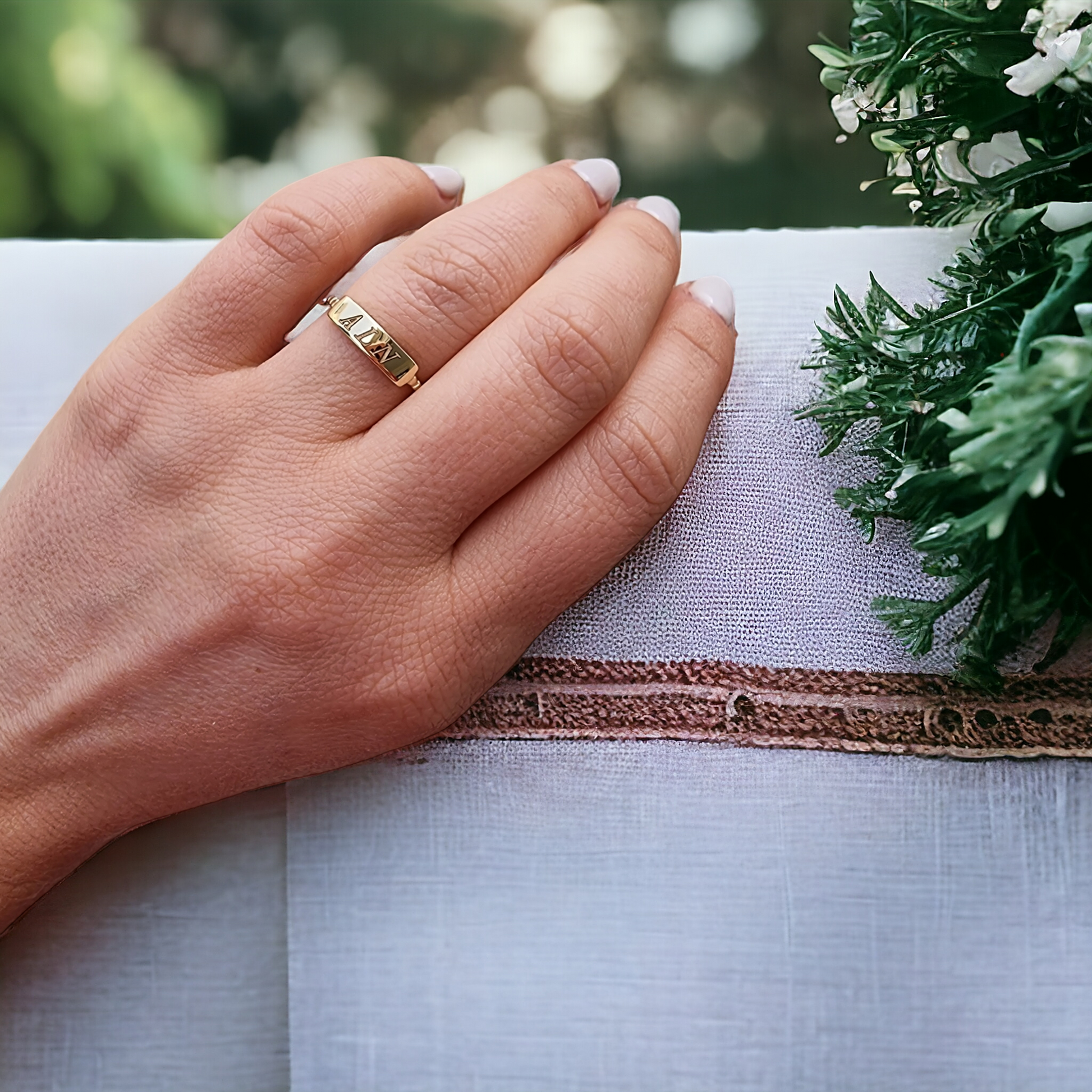 A personalized bar ring for women, crafted in 14k gold and featuring a beaded design.