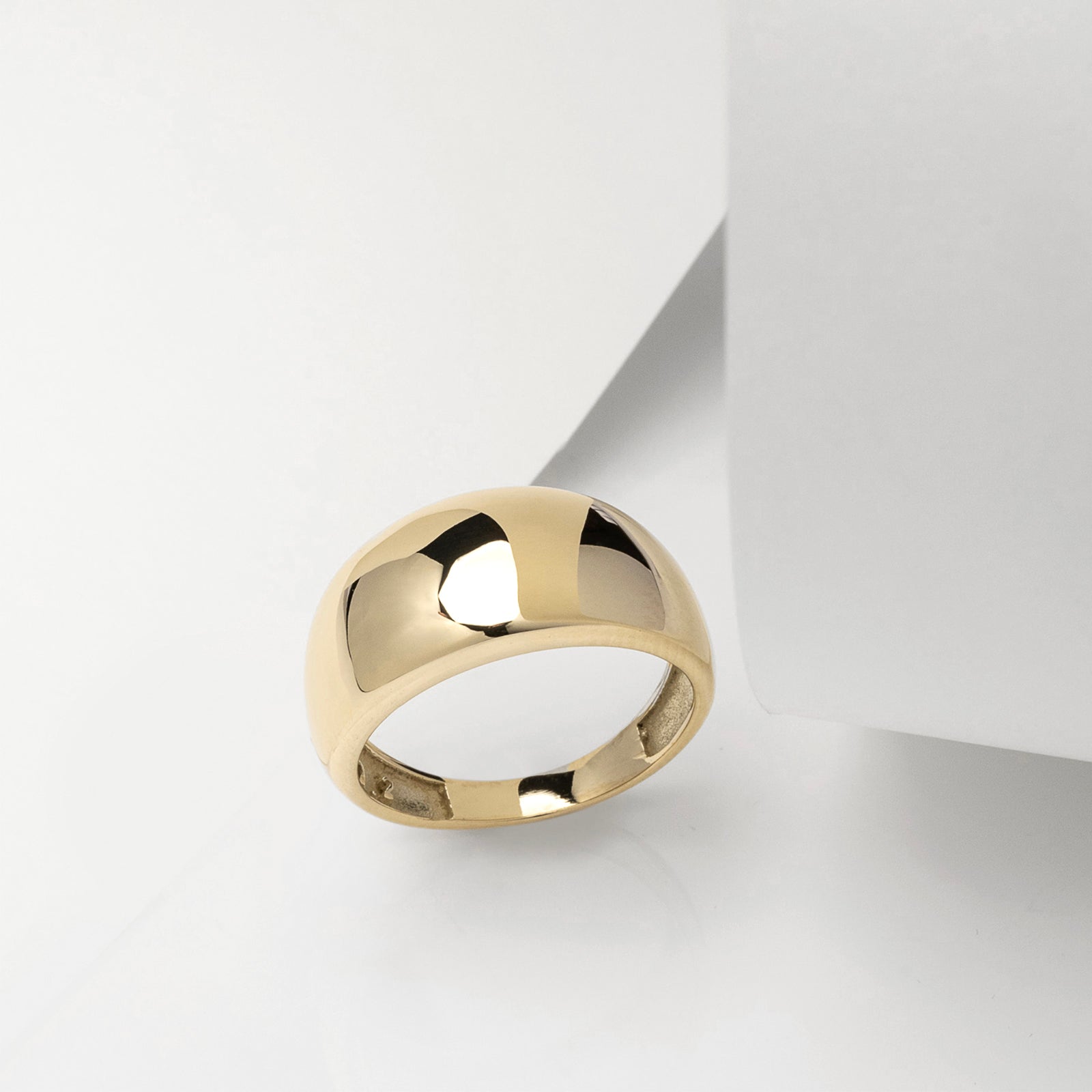 A thick 9mm dome ring crafted in 14k solid gold for women.