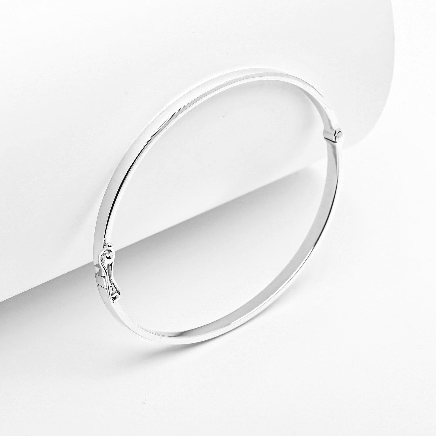 14k white Gold bangle on a white background