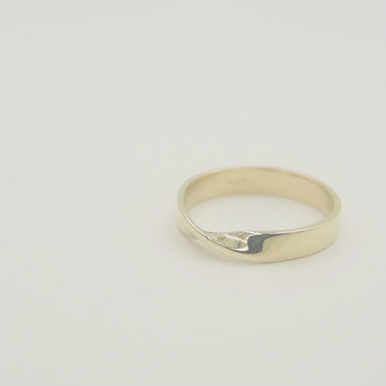 Thick Möbius ring in 14k solid gold for women.