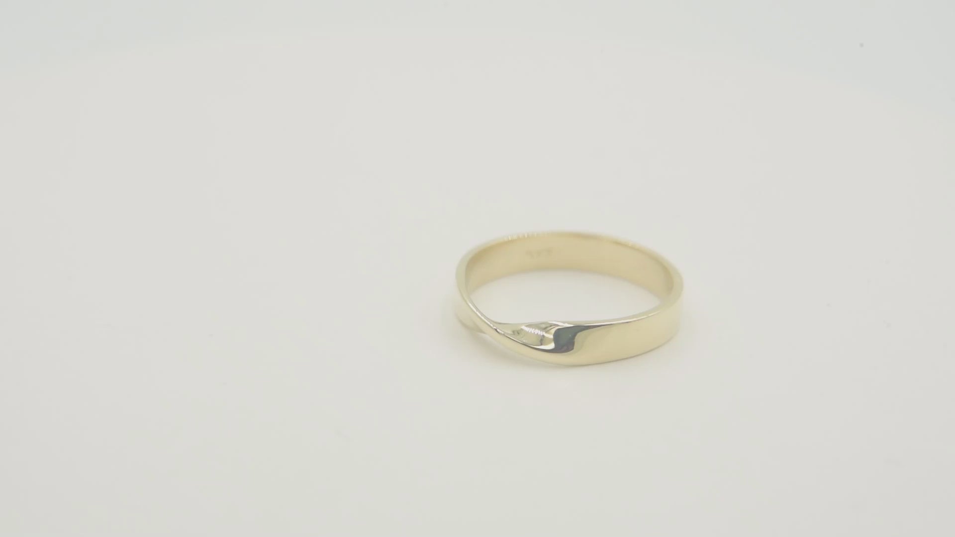 Thick Möbius ring in 14k solid gold for women.