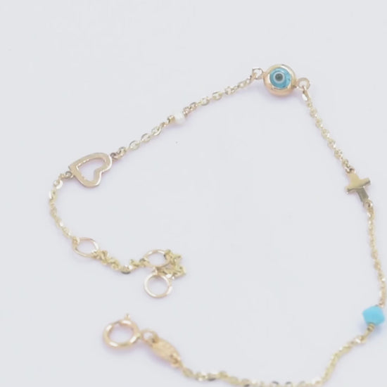 evil eye bracelet with cross, heart, pearl, turqoise stone in 14k solid gold