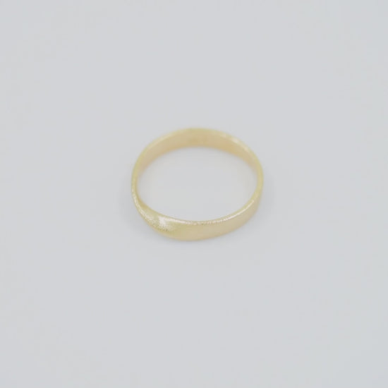 Sandblasted Möbius Ring in 14k solid gold for women.