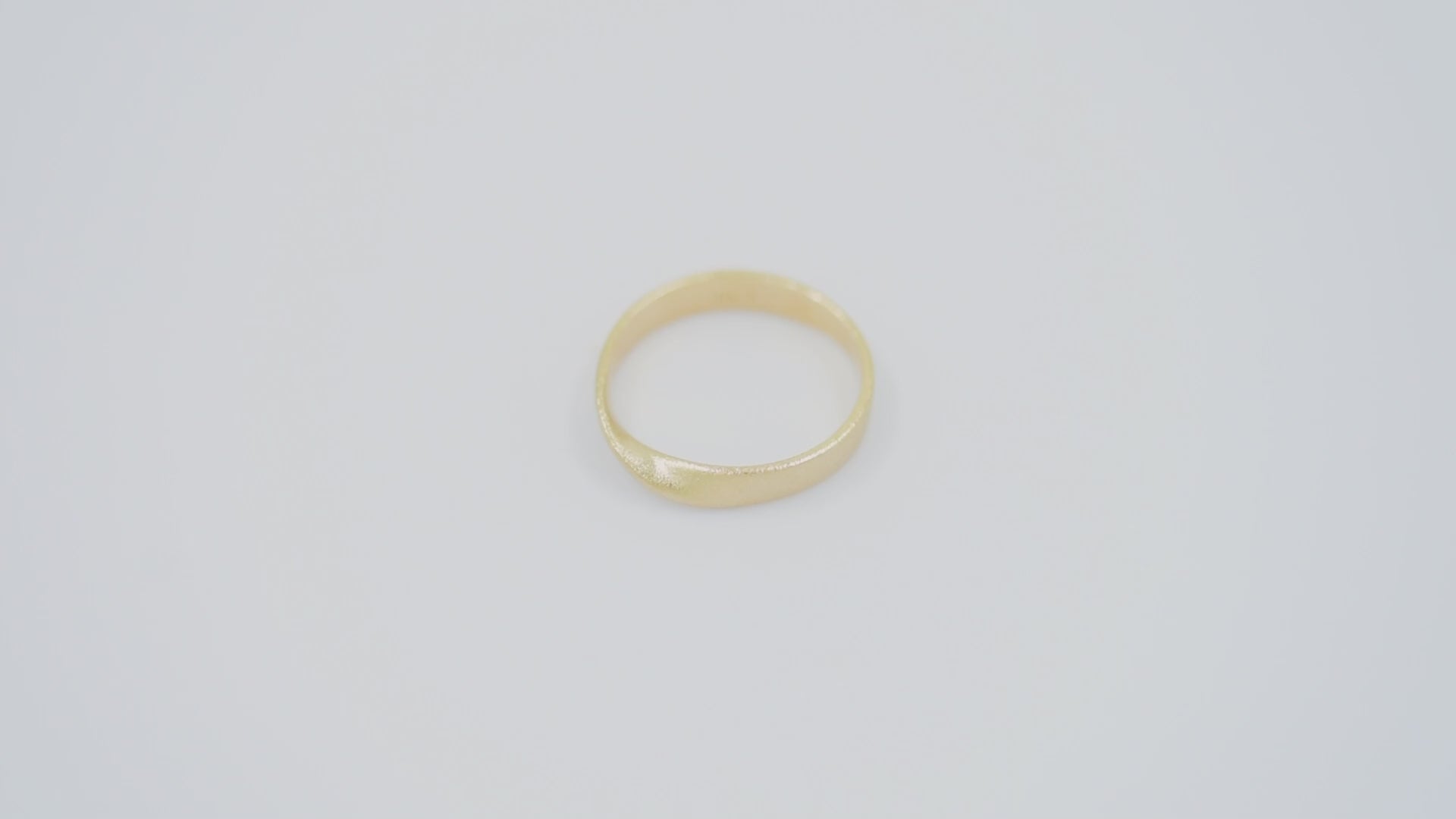 Sandblasted Möbius Ring in 14k solid gold for women.