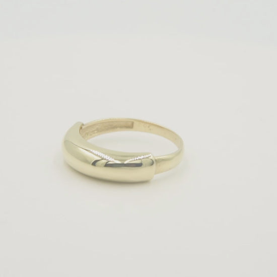 A dome ring for women crafted in 14k gold.