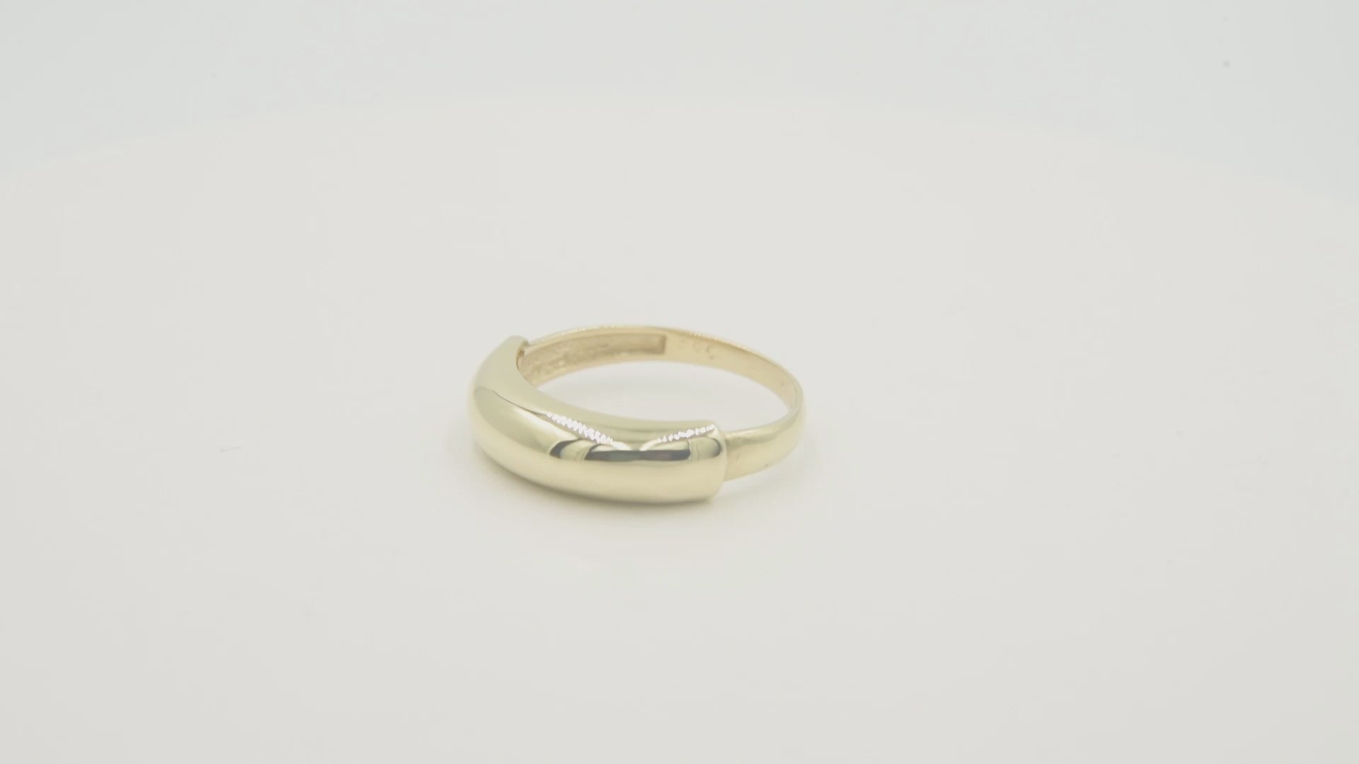 A dome ring for women crafted in 14k gold.