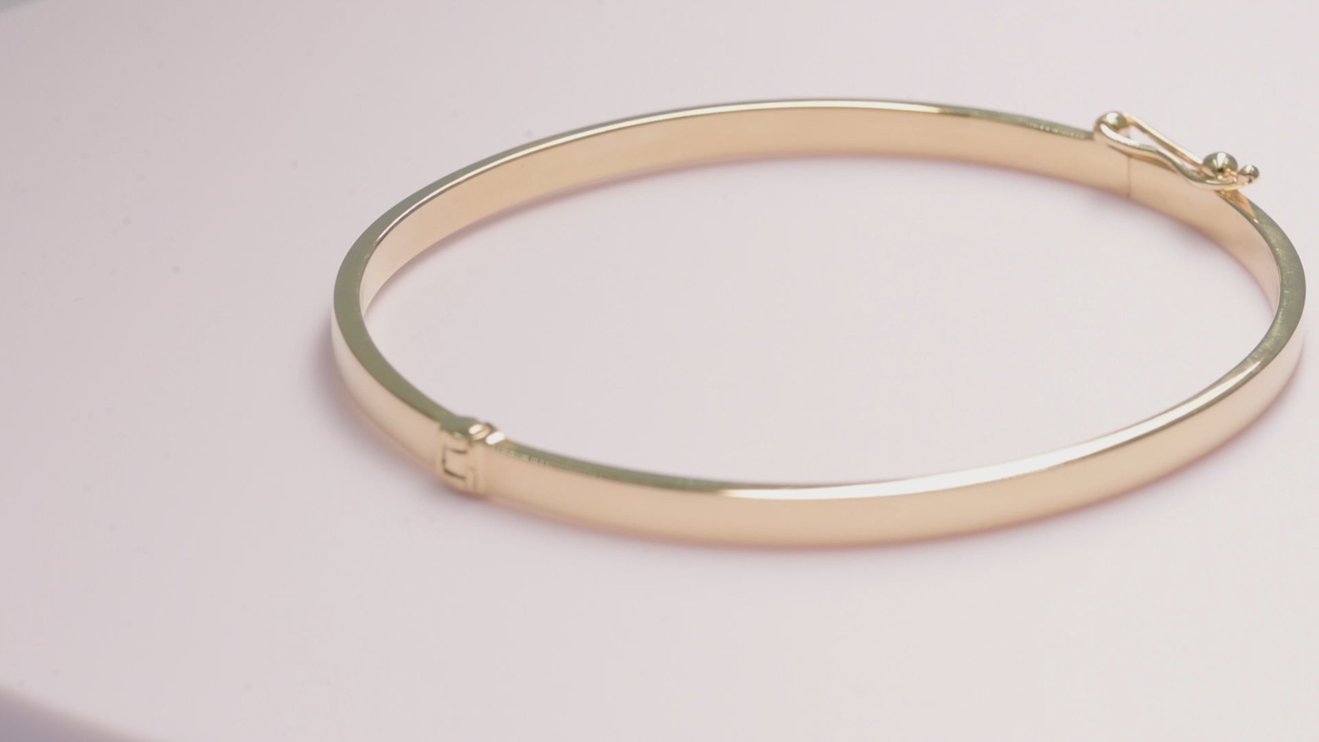 A 3.50mm bangle bracelet crafted in 14k yellow gold for 