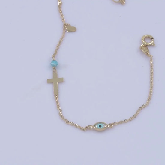 14k gold charm bracelet with cross, evil eye, heart, turquoise