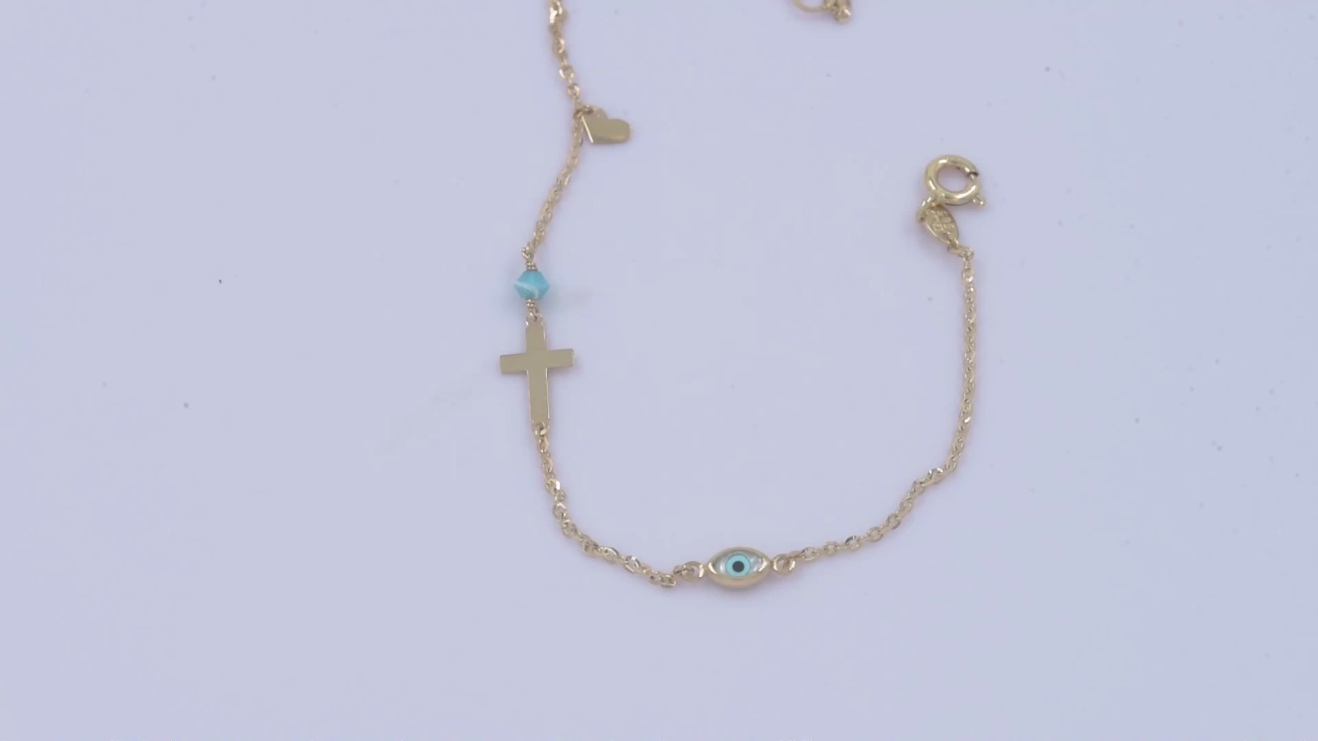 14k gold charm bracelet with cross, evil eye, heart, turquoise