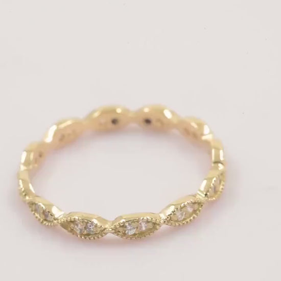 Handmade Eretiny band ring crafted in 14k gold, adorned with white cubic zirconia stones.