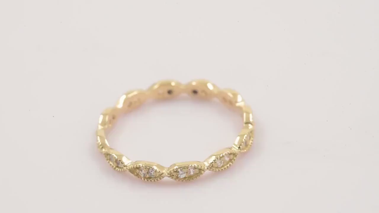 Handmade Eretiny band ring crafted in 14k gold, adorned with white cubic zirconia stones.